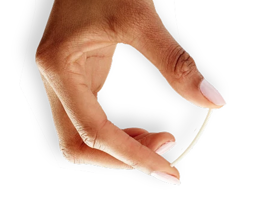 Hand Holding Implant Between Thumb and Index Finger to Show Relative Size of Implant